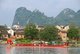 China: Dragon boat on the Li River with Seven Star Park in the background, Guilin, Guangxi Province
